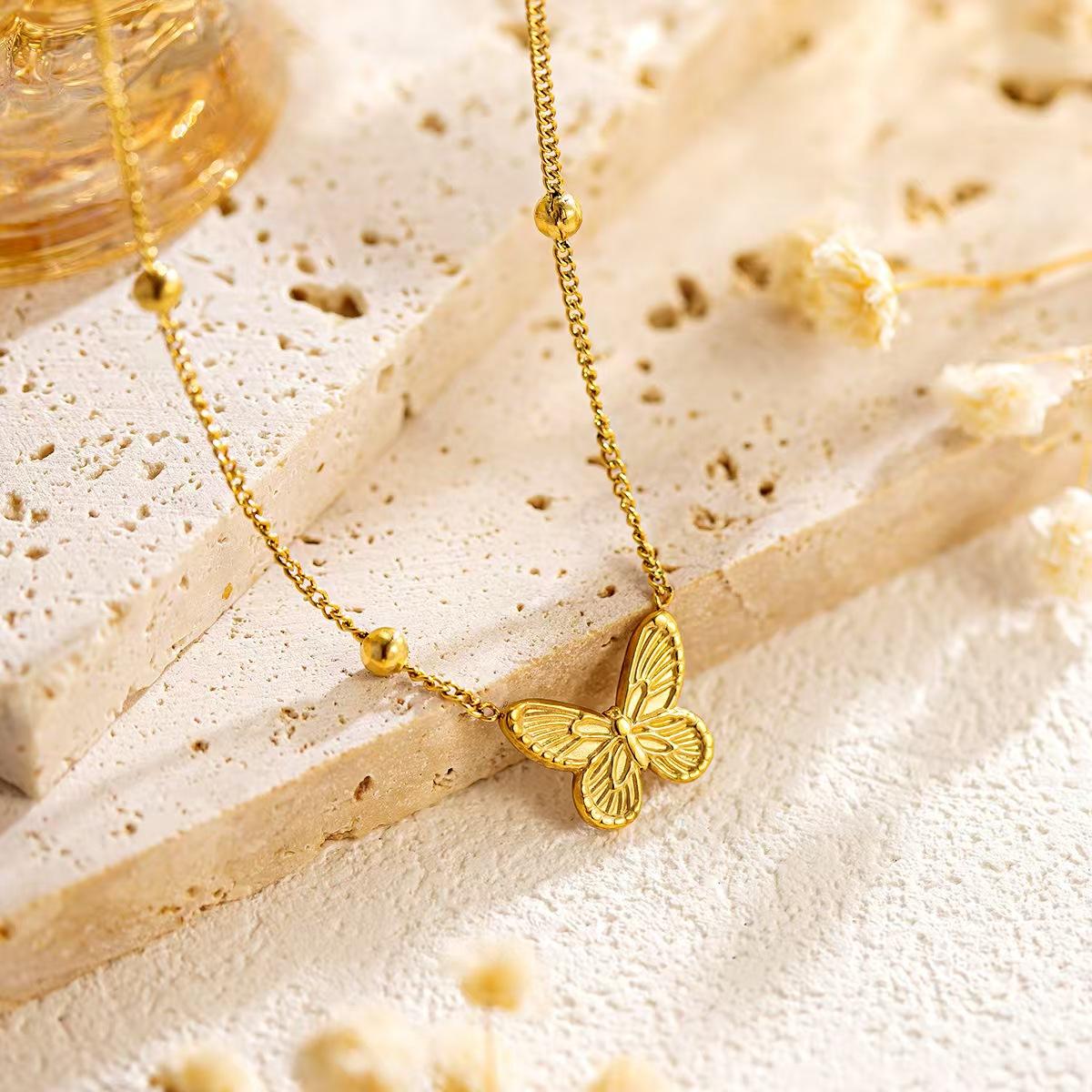 Collana Farfalla in acciaio color oro